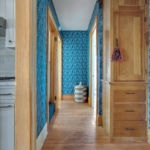 Blue knot wallpaper in hallway with global basket