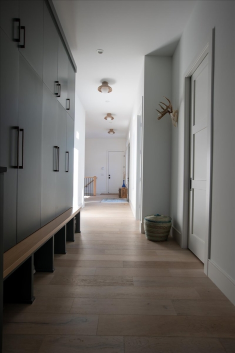 Back hallway with built-in mudroom cabinets