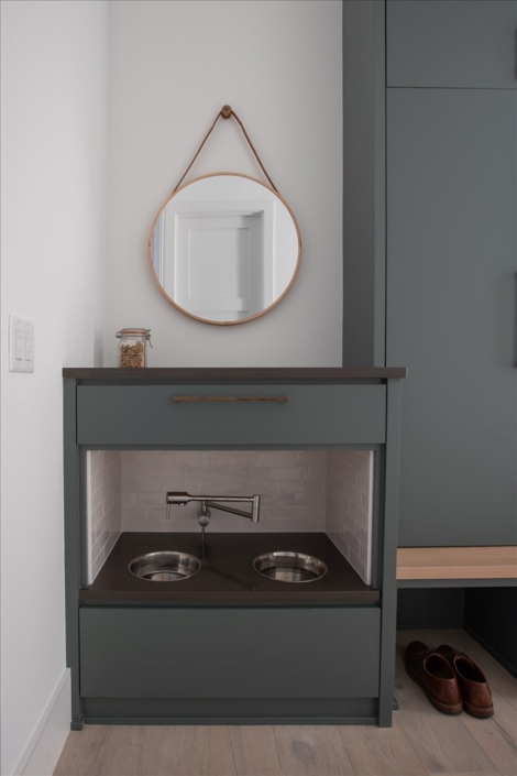 Mudroom with built-in dog dishes and water filler