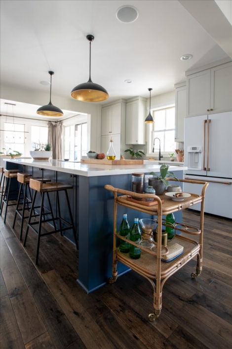 Bar cart and blue island with bar stools