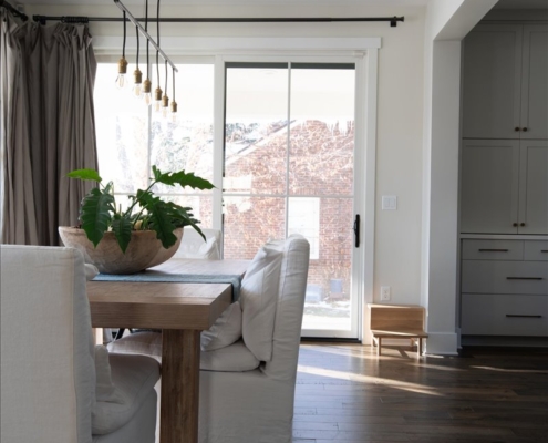 Wood farmhouse table paired with Restoration Hardware chairs