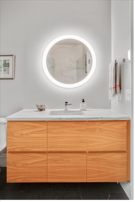 Bathroom vanity with round mirror