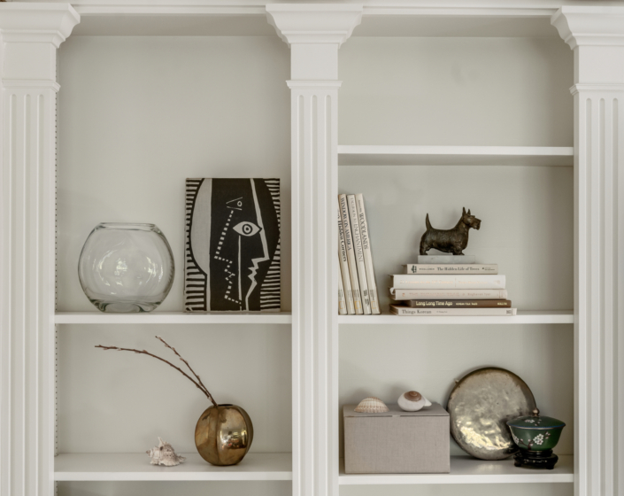 Bookshelf close up of art and curiosities