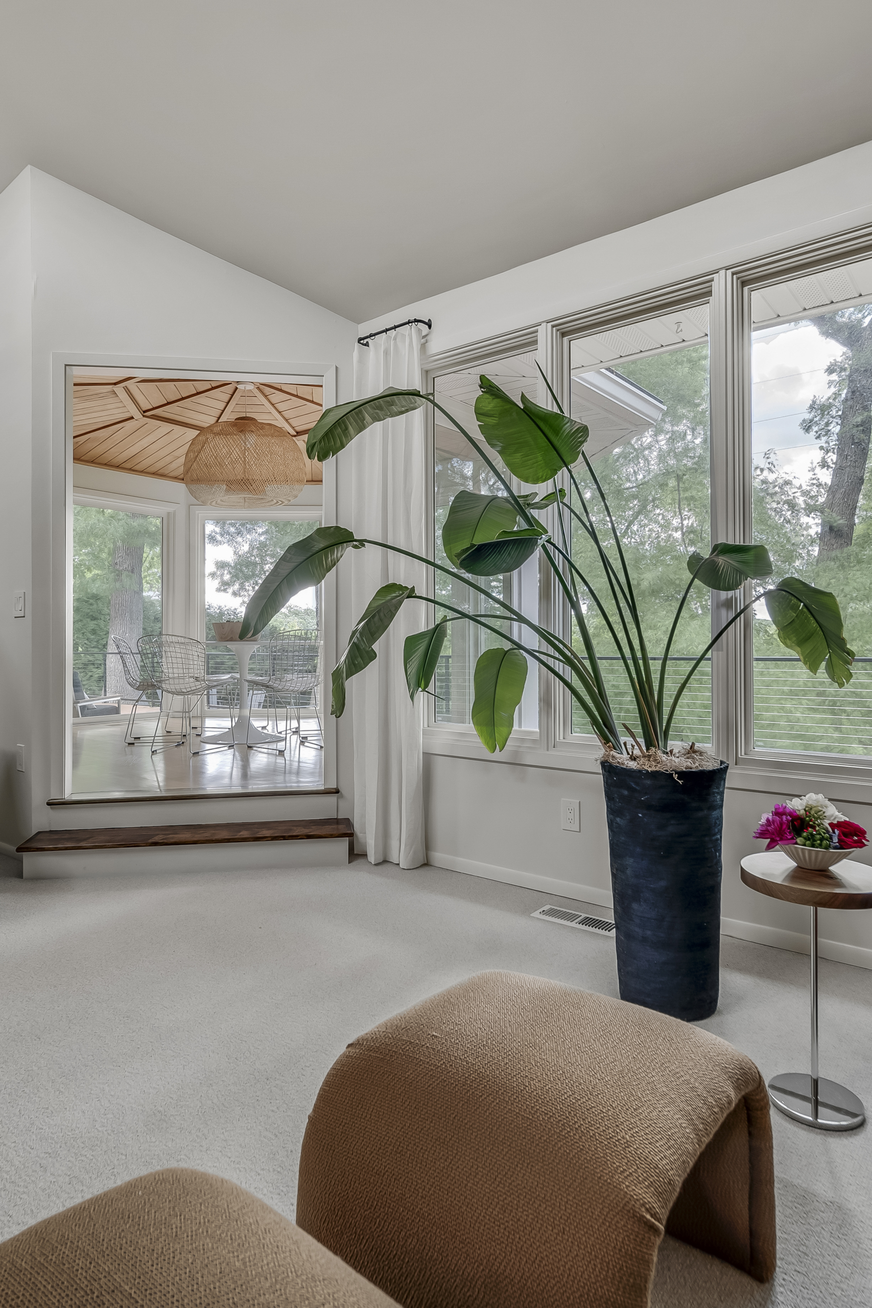 Family rm with plant looking into eating area